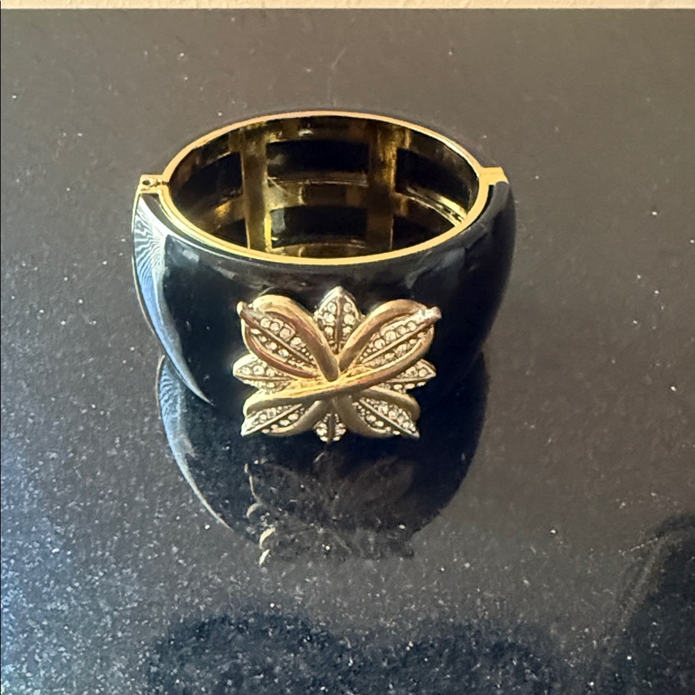 Elegant Black and Gold Bracelet with Floral Accent